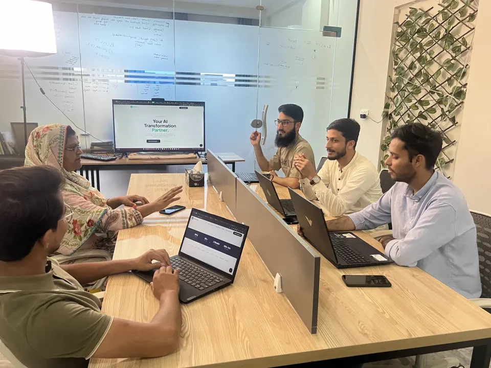 AI Data House colleagues collaborating around a table